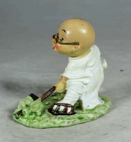 Kung Fu Buddha with a fighting stick