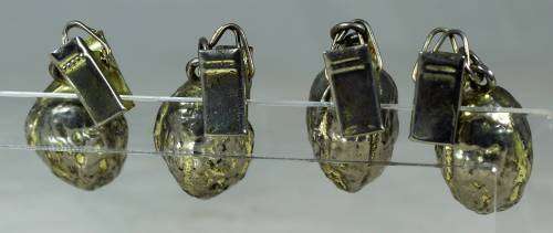 Four metal table cloth holders