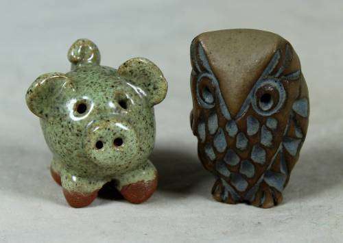 Miniature stone owl and piglet