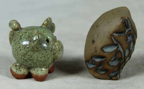 Miniature stone owl and piglet