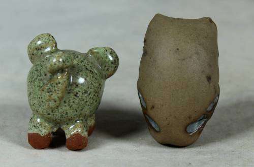 Miniature stone owl and piglet