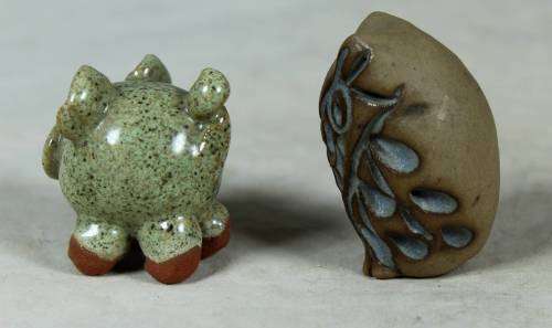 Miniature stone owl and piglet