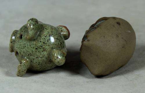 Miniature stone owl and piglet