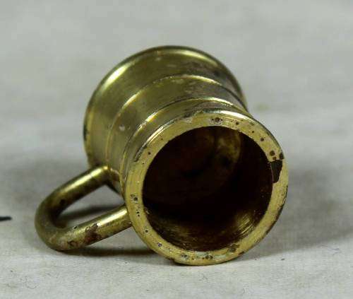 Miniature handcrafted brass temptations mug