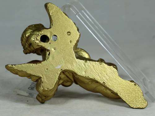 Molded cherub playing guitar
