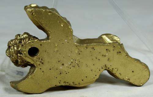 Molded cherub playing the flute