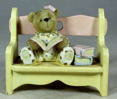 VERY INTELLIGENT LITTLE BEAR READING ON A BENCH-BID NOW!!
