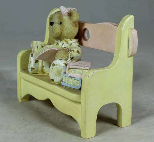 VERY INTELLIGENT LITTLE BEAR READING ON A BENCH-BID NOW!!