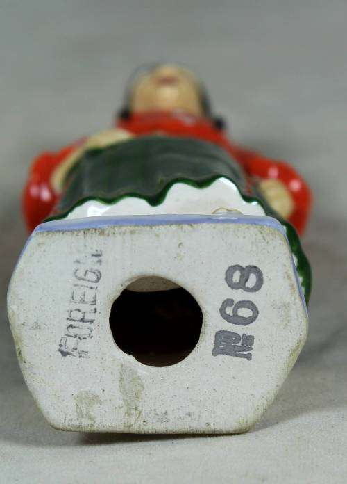 VINTAGE PORCELAIN FIGURINE (MARKED FOREIGN)-WOMAN DRESSED IN TRADITIONAL CLOTHES #68