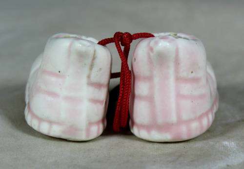 miniature pair of porcelain baby shoes