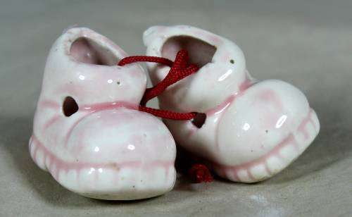 miniature pair of porcelain baby shoes