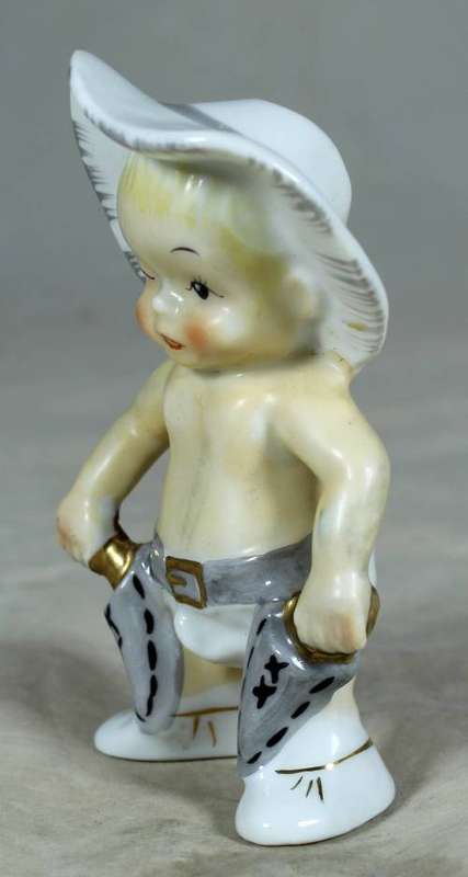 Porcelain standing cowboy baby, ready for action