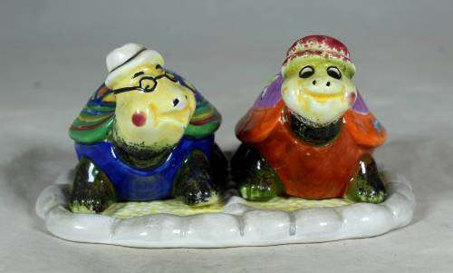 Set of tortoise salt and pepper shakers on a stand
