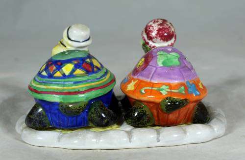 Set of tortoise salt and pepper shakers on a stand