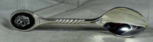 Souvenir spoon hand crafted with a lion head