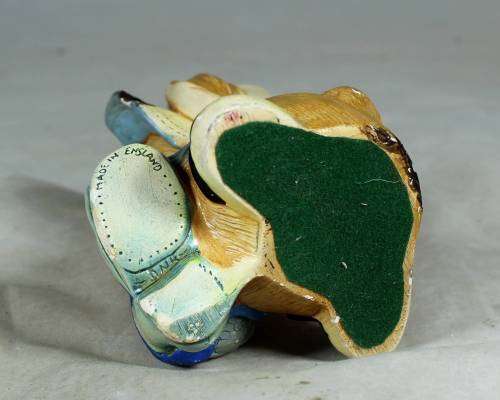 Hand painted stone craft rabbit with a fish and a shoe
