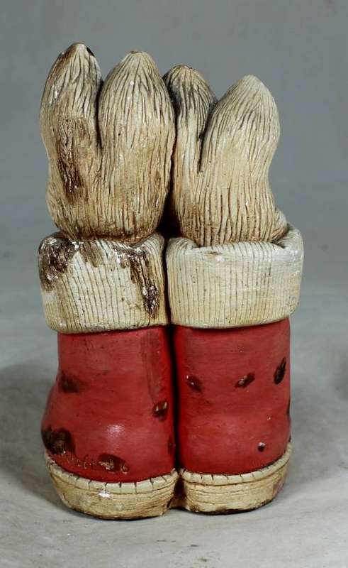 hand painted stone craft rabbits in a red pair of shoes