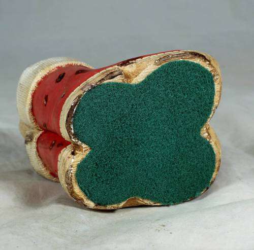 hand painted stone craft rabbits in a red pair of shoes