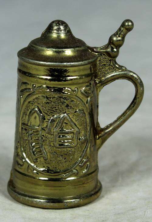 Miniature brass German beer stein