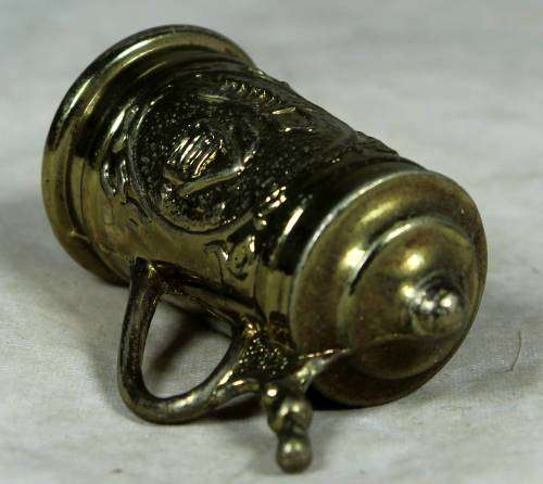Miniature brass German beer stein