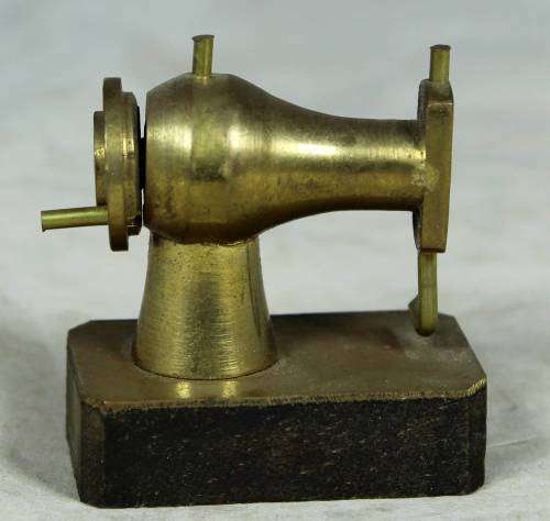 Miniature brass sewing machine