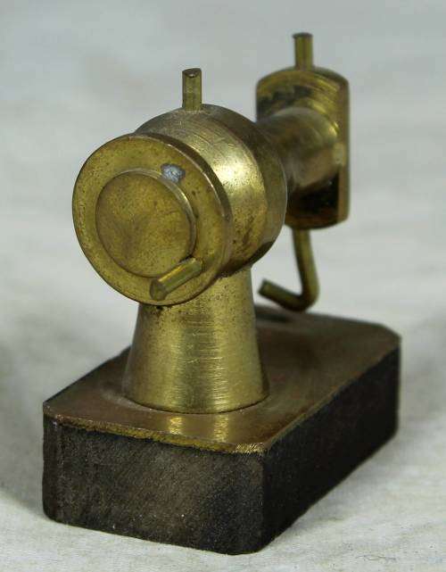 Miniature brass sewing machine