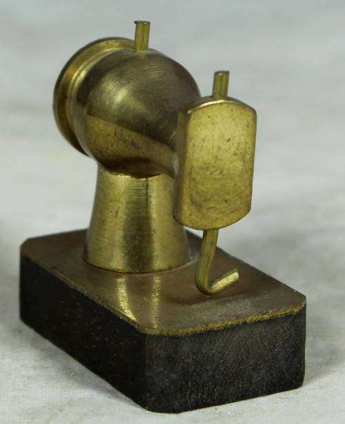 Miniature brass sewing machine