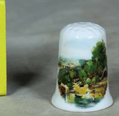Porcelain thimble - bridge covered by trees