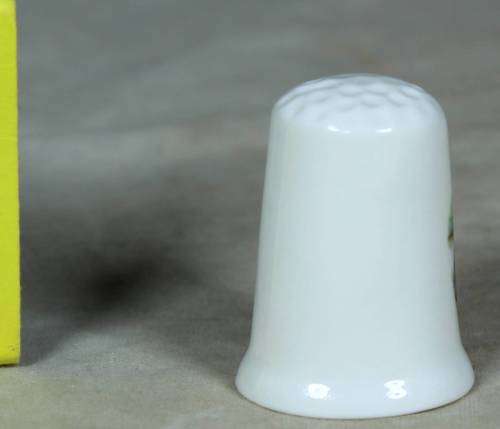 Porcelain thimble - bridge covered by trees