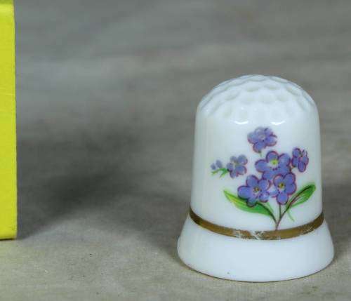 Porcelain thimble with purple flowers