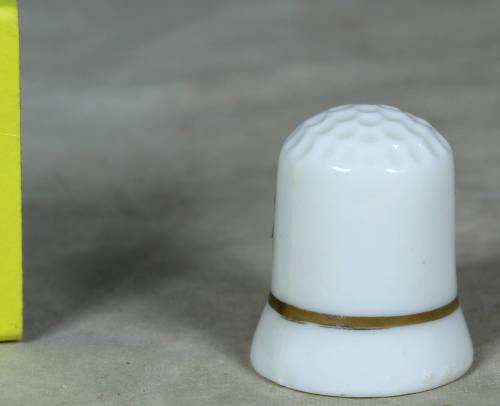 Porcelain thimble with purple flowers