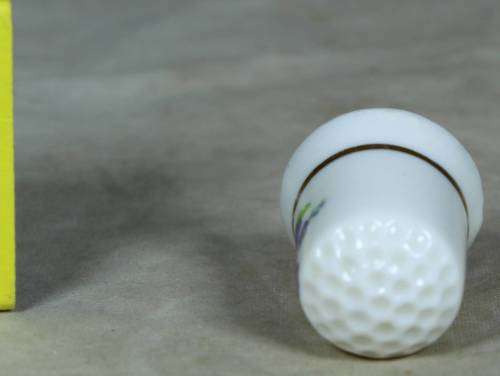 Porcelain thimble with purple flowers