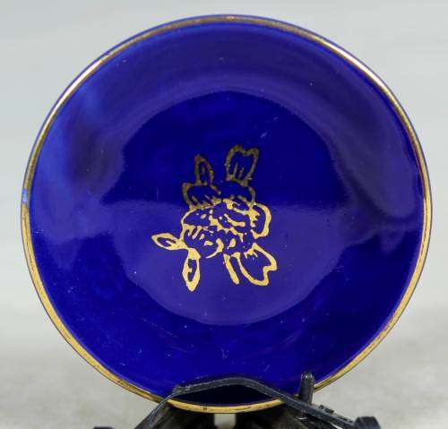Miniature porcelain display plate - royal blue with a gold flower