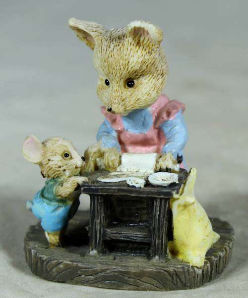 Miniature mama bear and baby bear baking