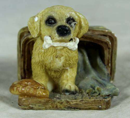 Miniature little puppy in a basket