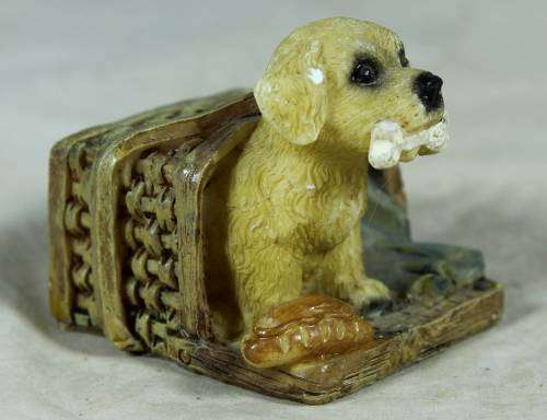 Miniature little puppy in a basket