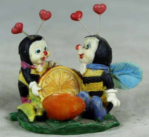 Miniature little bees having fun with a lemon