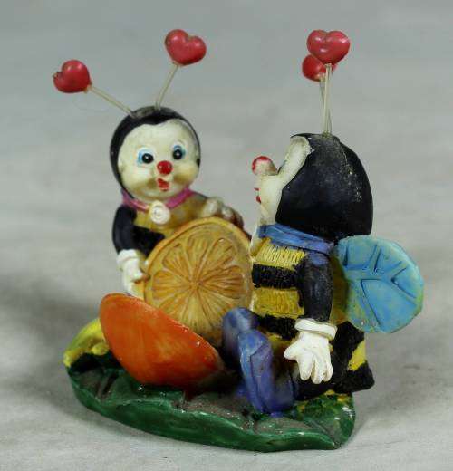 Miniature little bees having fun with a lemon