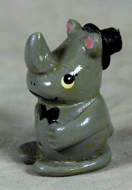 MINIATURE-HAND PAINTED RHINO WITH A TOP HAT BY CHARMAINE-BID NOW!