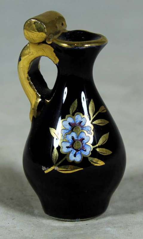 Miniature  gold and blue pitcher