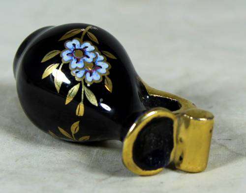 Miniature  gold and blue pitcher
