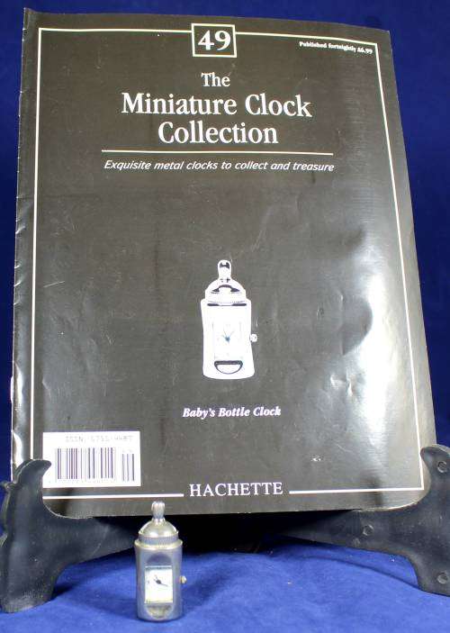 Hachette clock with booklet - Babies bottle