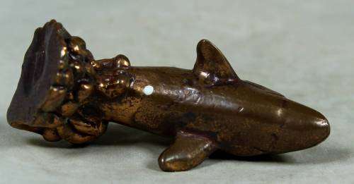 Miniature brass color lead dolphin