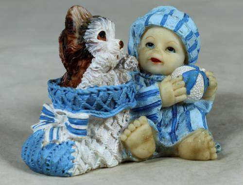 Baby with a cat in a basket