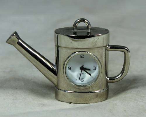 Silver plated watering can with miniature watch