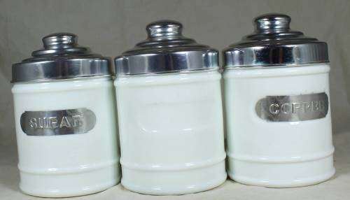 SET OF THREE GLASS CONTAINERS WITH METAL LIDS BID NOW!!