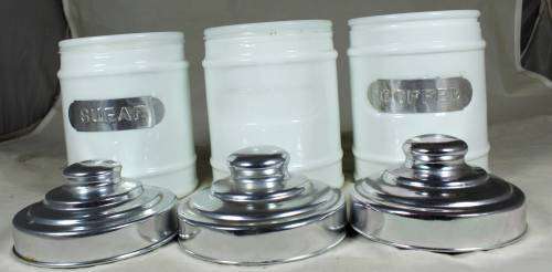 SET OF THREE GLASS CONTAINERS WITH METAL LIDS BID NOW!!