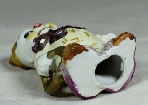 Smiling clown with a gold ring