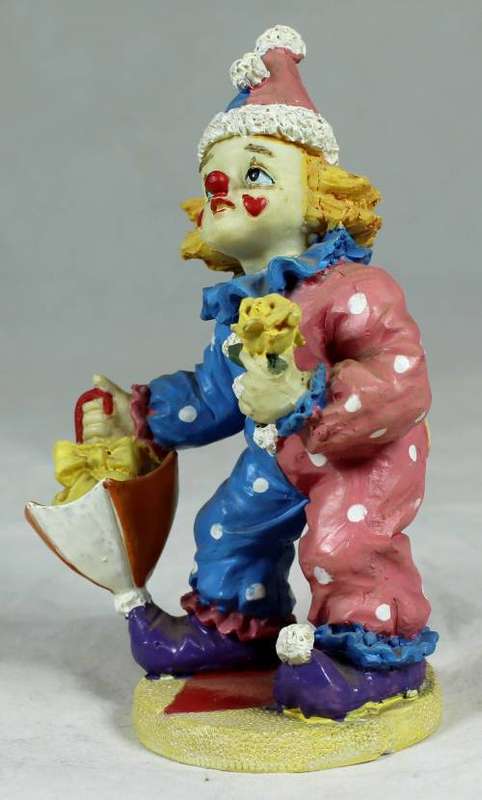 Clown with flowers and umbrella