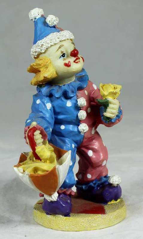 Clown with flowers and umbrella